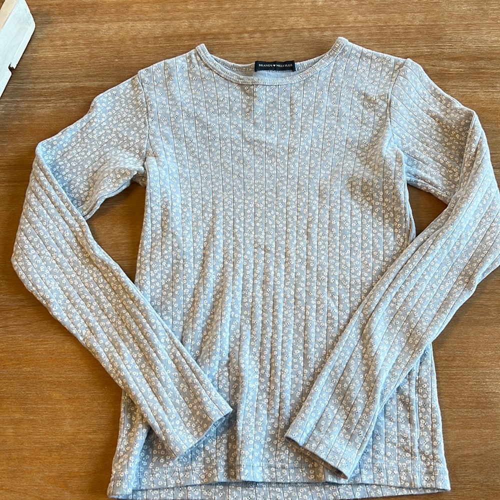 Blue floral long sleeve shirt from Brandy Melville. Never worn, great condition